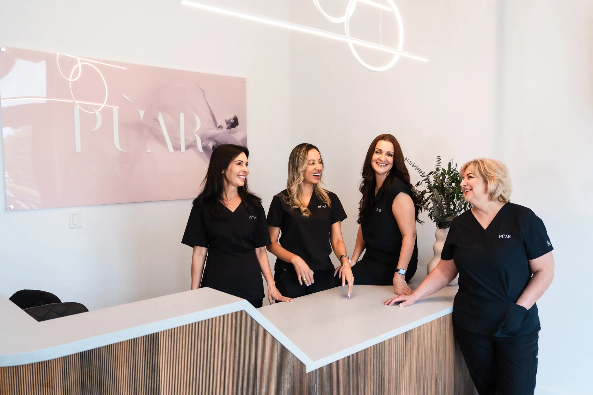 PÙAR team at the front desk of the Lake Mary studio